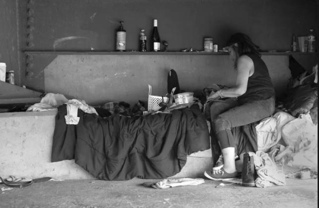 Mary works to straighten out her home under a bridge near downtown Tulsa courtesy photo