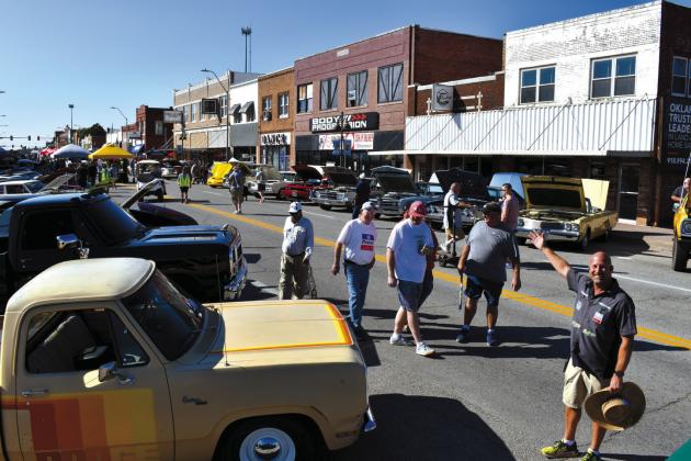 Doug Cataline, on the right, organized and ran the Southern Plains Mopar Festival. He donated $1000 to help have the 102-foot Chrysler Plymouth tower repaired. courtesy photo