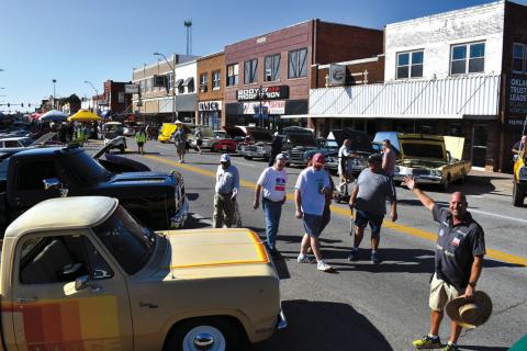 Doug Cataline, on the right, organized and ran the Southern Plains Mopar Festival. He donated $1000 to help have the 102-foot Chrysler Plymouth tower repaired. courtesy photo