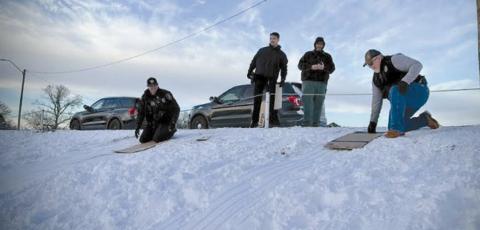 The community’s police department gathered with the kids to be a kid for a short time, sledding with and showing the kids that police officers are really the good guys, even in sub zero weather. by Jessica Lynn