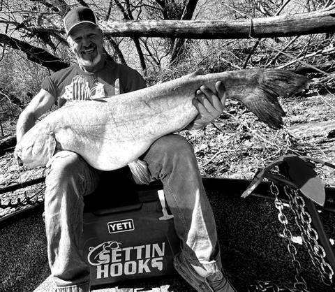 Doug Eastman with a blue catfish he caught at Grand Lake.