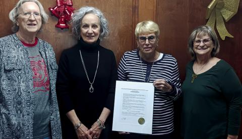 Virginia Ray, VFW Auxiliary President Ruth Jaytanie, and Margaret Foster receiving the Wake Island Memorial Day proclamation from Mayor Kris Wyatt. courtesy photo