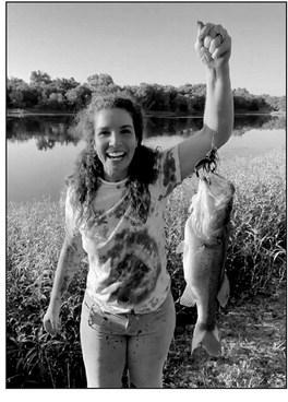 Sarah Hall with a bass she caught in Cleveland County. courtesy photo