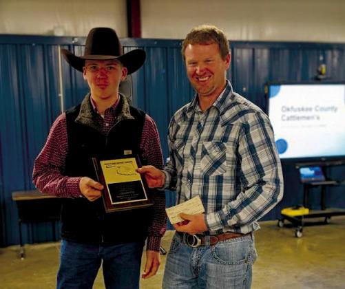 Record Book Champion Hayden Danker receives his plaque and prize from OCCA President courtesy photo