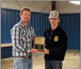 OCCA President Buck Rich presents Reserve Grand Champion Nile Ellis with his plaque and prize money. courtesy photo
