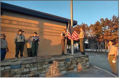 Boy Scout Troop 571 recently performed a color guard ceremony at the Monfort &amp; Allie B Jones Memorial Library and helped the library retire its old flag.