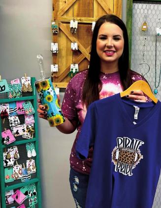 Paige Wood with some of the items she offers in her store.