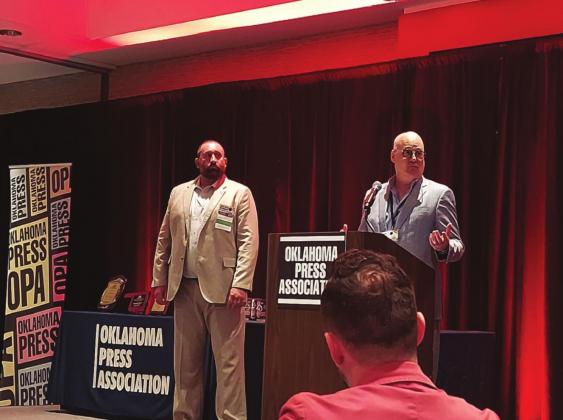 Brett Wesner, Wesner Publications and owner/publisher of the Bristow News addresses the audience during lunch. Pictured left is John Denny Montgomery, President of the Oklahoma Press Association and right is Brett Wesner, National Newspaper Association Chair. Angie Gentry photo