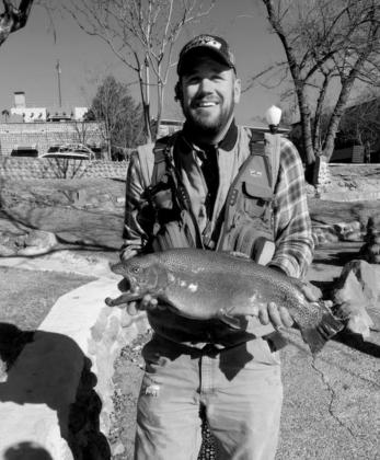 Michael Edmondson with a large rainbow trout he caught at Medicine Creek. courtesy photo