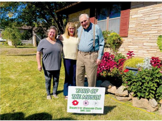 The Bristow Garden Club chose 519 West 7th, Bristow, as the September Yard of the Month. The residence belongs to Joe and Linda Vassar. From left is Sheryl Cortex, Linda Vassar and Joe Sam Vassar. courtesy photo