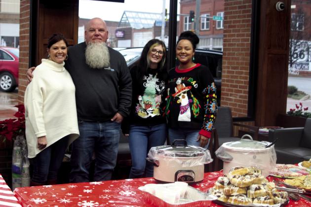 Vicki Grisham photo Community Bank held its Holiday Open House on Friday, Dec. 14. Lots of goodies were available to all those who stopped by for the holidays. Pictured from left is Connie McGuire, Mike Widdoes, Ashley Jones and Peyton Bruner, all from Community Bank.