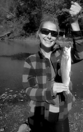Kristen Reese with a rainbow trout caught at the Lower Illinois River. courtesy photo