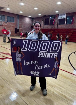 Depew High School basketball player Lauren Carrie hit her 1000th point at the Depew vs. Drumright game Friday night.