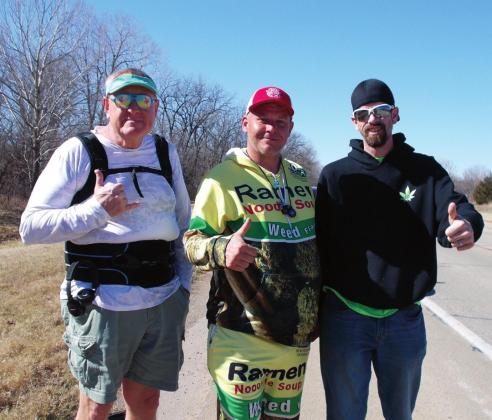 From left, Steve Henderson, Tony Andrews and Shawn Overstreet taking a break on their walk-a-thon for mental health awareness. Stephanie Summers photo