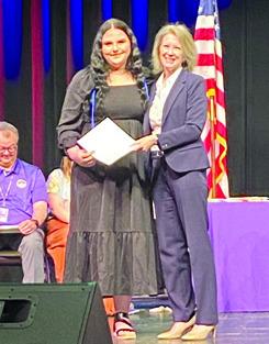 Lissa Steadley, Tulsa Community College dual credit director presents Kinlee Snell, a Bristow High School senior with cords at an awards ceremony last week. Snell is earning an associate degree in Pre-Nursing from TCC at the same time she graduates high school. courtesy photo