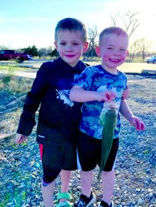 Cousins Trainor Thrash and Bennett Hudson pose with a bass caught at Ft. Supply Lake. courtesy photo