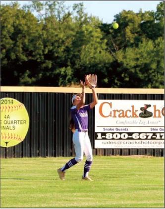 Kinzie Williams catches a fly ball against Inola.