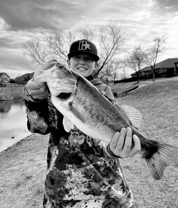 Hayden Frohling with a largemouth bass caught in Oklahoma County.