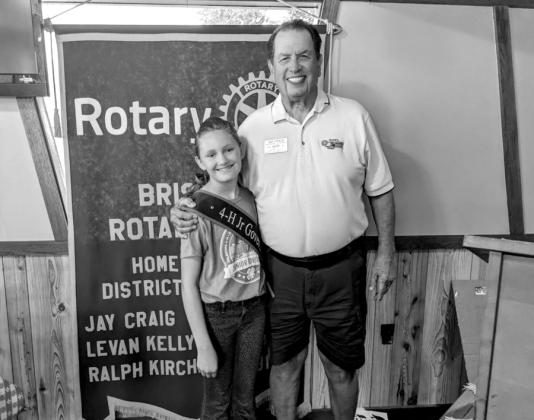 courtesy photo After challenging the 4-H to match collecting 1,000, Riley Braden spoke to the Rotary Club about also matching the challenge. Braden is shown here with Dr. Jay Craig of the Roatry.