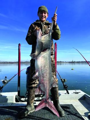 Dylan Dickey with a paddlefish caught at Grand Lake. courtesy photo