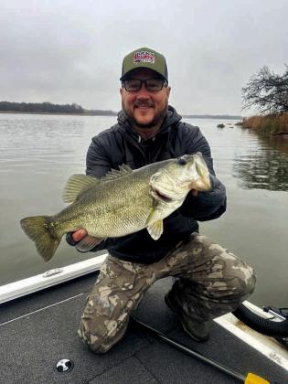 Aaron Cooper with a largemouth bass caught at Konawa Lake.