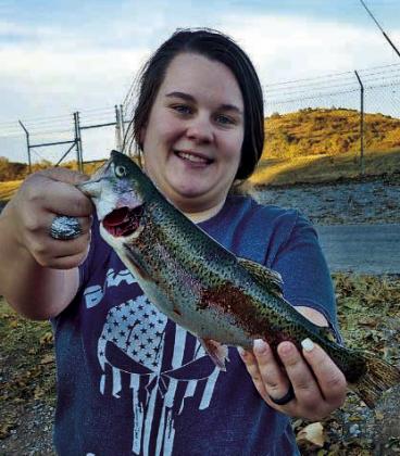 Audrianna Maurent holds a rainbow trout she caught recently at the Medicine Creek trout fishing area courtesy photo