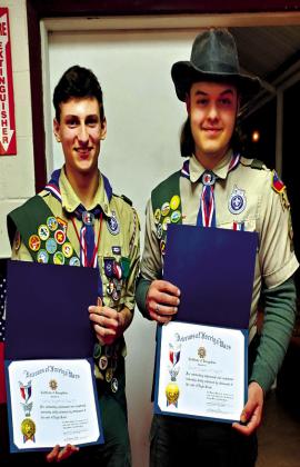 courtesy photo Eagle Scouts Nathan Burgett and Jacob Ingram hold their awards.