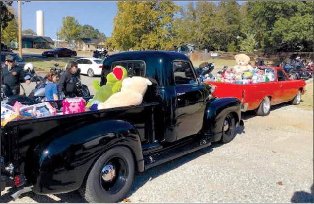 The annual Hawg Wild Toy Run was held Saturday, Nov, 4, A great turn out it was, with bike and car enthusiasts, bringing Christmas gifts for children to be donated to the Bristow Social Services and Bristow Head Start. More photos on page three.