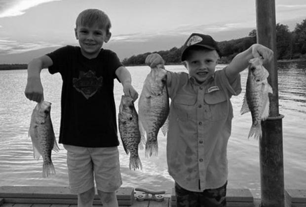 Fishing buddies, Beau and Boston, with some crappie they caught at Lake Thunderbird. courtesy photo