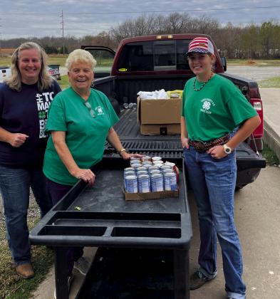 President of the Horse club delivering food to Bristow Social Serices. From left, Leaders Melinda Jone, Sharon Reagan and President of Horse Club Lydia Jones.