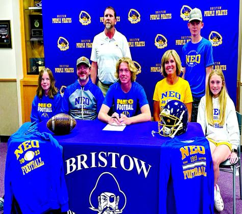 Ryder Goodwin signed as a kicker to Northeastern Oklahoma A&amp;M. Shown with his parents and siblings, along with Coach Jones. From left Rizden, Zane, Ryder, Mandy, Rainee and Roan (standing) . courtesy photo
