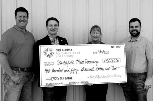 Oklahoma Department of Agriculture Food and Forestry presents checks from Cares Act