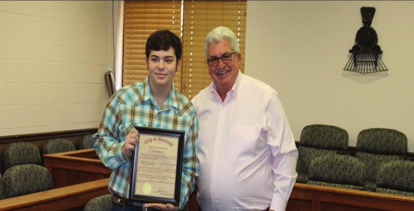 Mayor Rick Pinson presents Trevor Christian with a proclamation from the City of Bristow. Rebecca Langston photo