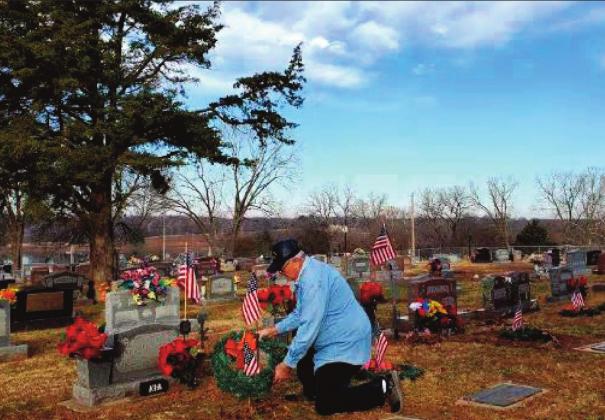 American Legion Adjutant Robert Mason places wreath on grave courtesy photo